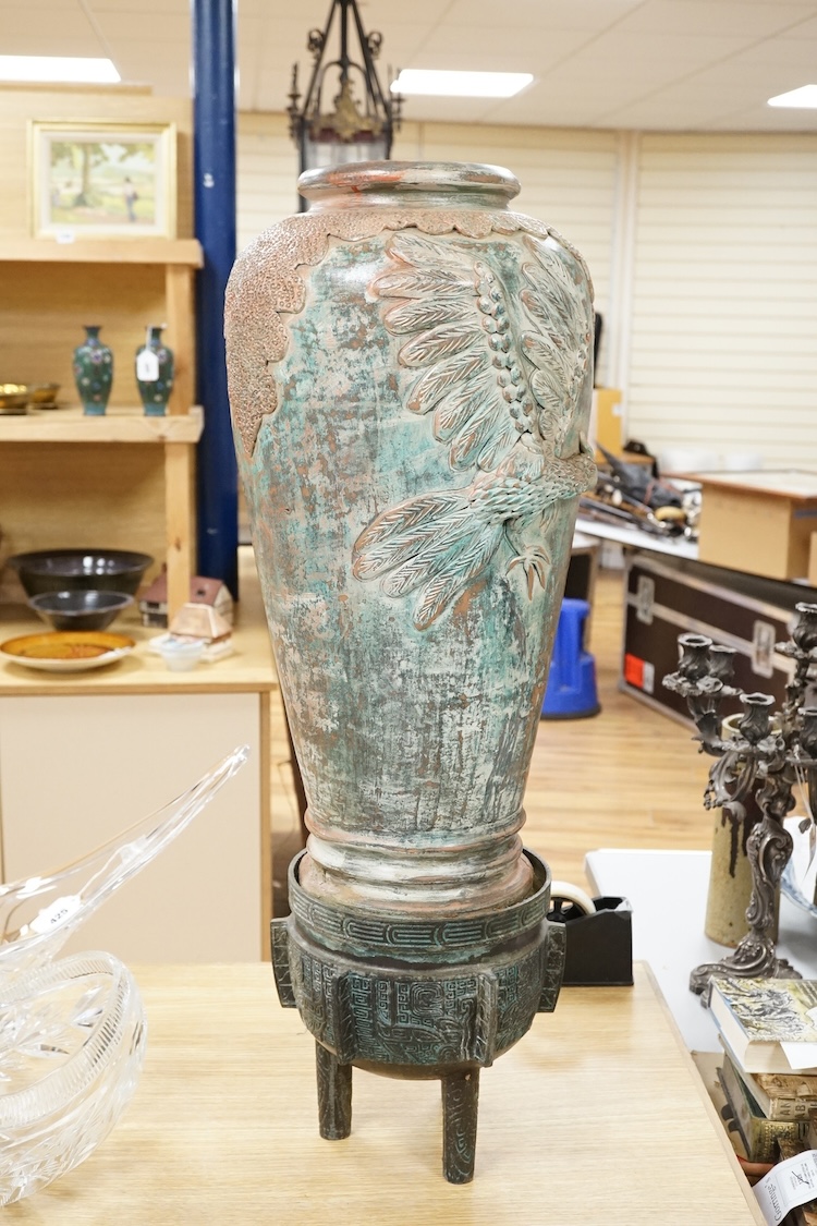 A large Chinese terracotta jar on archaistic stand, 83cm high
